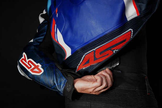 Detail of 4SR RR Blue AR racing jacket zipped securely to Tourismo Black motorcycle jeans for full riding safety and comfort.