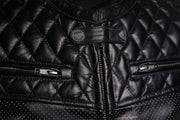 Close-up of Scrambler Petroleum II jacket showing front zipper, quilted chest stitching, and 4SR Racing snap detail