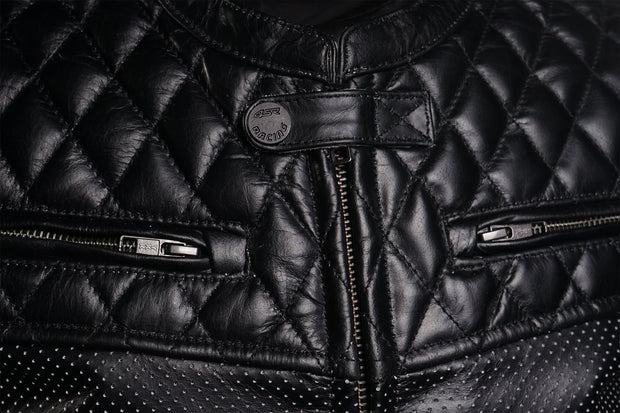 Close-up of Scrambler Petroleum II jacket showing front zipper, quilted chest stitching, and 4SR Racing snap detail