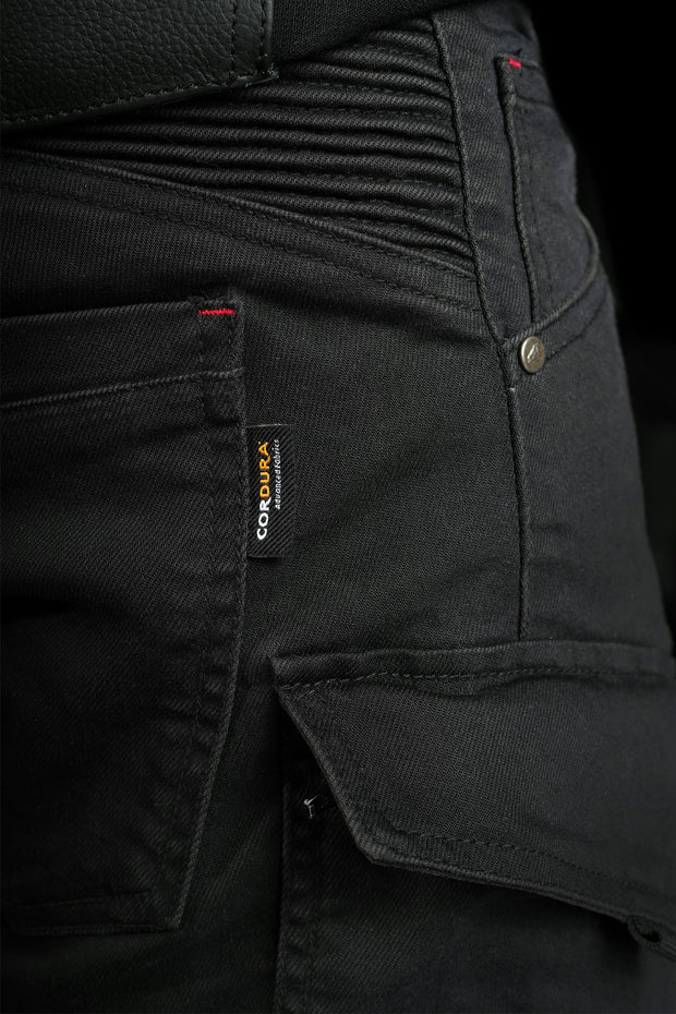 Detail of 4SR Tourismo Black motorcycle jeans side pocket with CORDURA® fabric tag, showcasing durable abrasion-resistant material.